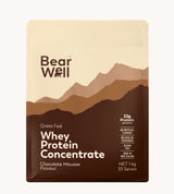 1kg Packaging of BearWell Grass Fed Whey Protein Concentrate in Chocolate Mousse flavour. The package is coloured in various shades of brown, with the brand logo and product details printed on the front.