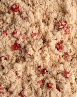 A close up view of the BearWell Mixed Berry flavoured whey protein powder
